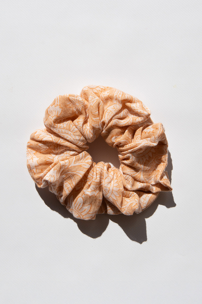 Daughters of India Upcycled Scrunchie in Apricot Blush, a soft peach-orange hair scrunchie made from upcycled cotton fabric